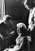 Allen 'Whitey' Snyder, Marilyn Monroe and Ralph Roberts on the set of 'The Misfits'