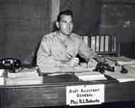 Ralph at his Desk in Burma